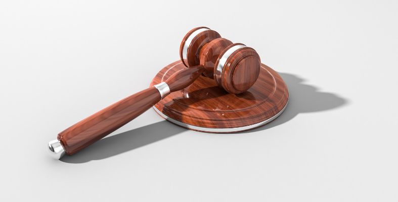 Rubber Glove Company Facing Charges for Withholding Foreign Workers' Salaries