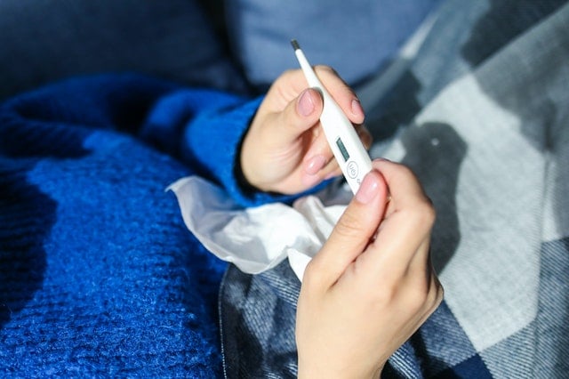 person checking thermometer