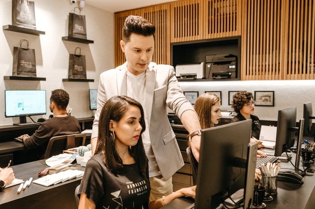 man instructing a woman